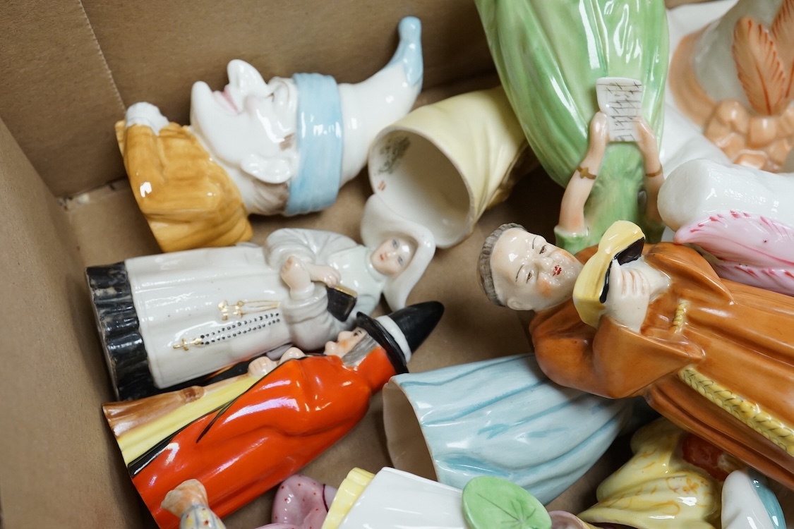 A collection of porcelain extinguishers to include Royal Worcester owl, Jenny Lind and Mandarin, largest 12cm high
